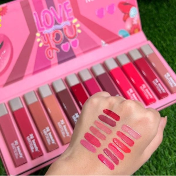 Box of 3Q Beauty matte lipgloss long lasting and waterproof set of 12 and swatches on hand